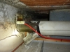 corrugated-asbestos-paper-form-lagging-to-heating-pipe-work